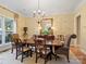Elegant dining room featuring a crystal chandelier, large mirror, and seating for six at 4510 Old Course Dr, Charlotte, NC 28277