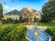 Lovely home with a manicured lawn and fountain at 4510 Old Course Dr, Charlotte, NC 28277