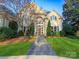 Charming home featuring manicured landscaping, a brick pathway, and a classic facade at 4510 Old Course Dr, Charlotte, NC 28277