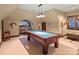 Game room featuring a pool table, unique decor, and natural light at 4510 Old Course Dr, Charlotte, NC 28277