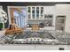 Gourmet kitchen with stainless steel appliances and custom tile backsplash at 4510 Old Course Dr, Charlotte, NC 28277