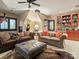 Eclectic living room featuring unique decor, comfortable seating, and built-in display cabinet at 4510 Old Course Dr, Charlotte, NC 28277