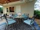 Outdoor patio featuring elegant dining set, neutral furnishings, and stylish décor perfect for entertaining and relaxation at 4510 Old Course Dr, Charlotte, NC 28277