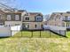 Backyard featuring a well-manicured lawn and townhome view at 4634 Craigmoss Ln, Charlotte, NC 28278