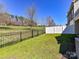 Fenced backyard with lush green grass and a scenic landscape at 4634 Craigmoss Ln, Charlotte, NC 28278