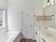Bathroom with double sink vanity, tile floors, and bath at 4634 Craigmoss Ln, Charlotte, NC 28278