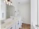 Bathroom with double sink vanity, tile floors, and modern fixtures at 4634 Craigmoss Ln, Charlotte, NC 28278