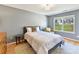 Bedroom with a neutral color palette, a window view, and hardwood floors at 4634 Craigmoss Ln, Charlotte, NC 28278