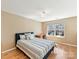 Inviting bedroom with a cozy bed, hardwood floors, and a view from the window at 4634 Craigmoss Ln, Charlotte, NC 28278