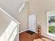 Bright entryway featuring a staircase, hardwood floors, and lots of natural light at 4634 Craigmoss Ln, Charlotte, NC 28278