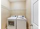 Bright laundry room with shelving and modern LG washer and dryer at 4634 Craigmoss Ln, Charlotte, NC 28278