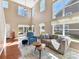 Sun-filled living room featuring hardwood floors and stylish furnishings at 4634 Craigmoss Ln, Charlotte, NC 28278