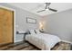Cozy bedroom features a ceiling fan, wood floors, and modern decor at 4790 Polk Ford Rd, Stanfield, NC 28163