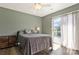 Comfortable bedroom with natural light from the sliding glass doors to the outdoor deck at 4790 Polk Ford Rd, Stanfield, NC 28163
