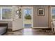 Inviting foyer featuring hardwood floors, natural light, and stylish interior doors at 4790 Polk Ford Rd, Stanfield, NC 28163