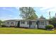 Lovely single-story home with gray siding, black shutters, and a well-maintained front lawn at 4790 Polk Ford Rd, Stanfield, NC 28163