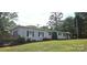 Charming single-story home with gray siding, black shutters, and a well-manicured lawn at 4790 Polk Ford Rd, Stanfield, NC 28163
