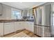 Modern kitchen with stainless steel appliances, granite countertops, and updated cabinetry at 4790 Polk Ford Rd, Stanfield, NC 28163