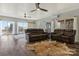 Inviting living room with recliners, hardwood floors, and access to a deck at 4790 Polk Ford Rd, Stanfield, NC 28163