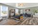 Well-lit living room featuring hardwood floors and comfortable furniture at 4790 Polk Ford Rd, Stanfield, NC 28163