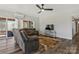 Comfortable living room with recliners, hardwood floors, and bright natural light at 4790 Polk Ford Rd, Stanfield, NC 28163