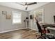 Home office with wood-look floors, windows, and a ceiling fan at 4790 Polk Ford Rd, Stanfield, NC 28163