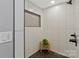 Modern shower with white tile, niche, and sleek black fixtures at 4790 Polk Ford Rd, Stanfield, NC 28163
