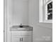 Bathroom features a granite countertop and a bright window at 513 Harrel St, Salisbury, NC 28144