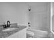 Bright bathroom features granite counters, updated fixtures, and a tub-shower combination at 513 Harrel St, Salisbury, NC 28144