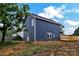 Rear view of a two-story home with dark blue siding and white trim at 513 Harrel St, Salisbury, NC 28144