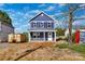 New construction home with blue siding, contrasted by white trim, offering a fresh and modern look at 513 Harrel St, Salisbury, NC 28144
