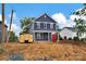 Charming two-story home with dark blue siding and a partially landscaped yard at 513 Harrel St, Salisbury, NC 28144