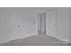 View of bright hallway with two white doors in unfinished construction at 513 Harrel St, Salisbury, NC 28144