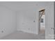 View of bright hallway with door leading to attic access at 513 Harrel St, Salisbury, NC 28144