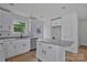 New kitchen featuring granite countertops, white cabinets, and a kitchen island at 513 Harrel St, Salisbury, NC 28144