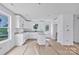 New kitchen featuring granite countertops, white cabinets, and a kitchen island at 513 Harrel St, Salisbury, NC 28144