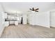 Bright, open-concept living space with modern fixtures, flowing seamlessly into the kitchen at 513 Harrel St, Salisbury, NC 28144