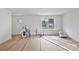 Bright living room with fresh white walls, natural light from the window, and door at 513 Harrel St, Salisbury, NC 28144