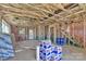 An unfinished living room and interior view reveals the home's frame with visible insulation at 513 Harrel St, Salisbury, NC 28144