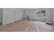 Bright living room with fresh white walls, natural light from the window, and door at 513 Harrel St, Salisbury, NC 28144