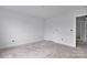 Clean, white room with base molding and a view into another area at 513 Harrel St, Salisbury, NC 28144