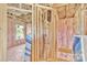 View of a room under construction with insulation and visible wood framing at 513 Harrel St, Salisbury, NC 28144