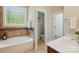 Well-lit bathroom with a tub and shower combination, and a separate toilet room at 8008 Battersea Ct, Waxhaw, NC 28173
