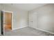 Comfortable bedroom with neutral carpet, a closet, and an attached bathroom at 8008 Battersea Ct, Waxhaw, NC 28173
