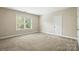Bedroom features a large window, providing plenty of natural light, and closet space at 8008 Battersea Ct, Waxhaw, NC 28173