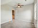 Bedroom with neutral walls, carpet, ceiling fan and access to a hallway at 8008 Battersea Ct, Waxhaw, NC 28173