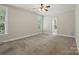 Large main bedroom boasts neutral carpet, natural light, and an en-suite bathroom at 8008 Battersea Ct, Waxhaw, NC 28173