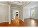 Elegant foyer featuring gleaming hardwood floors, high ceilings, and open access to other living spaces at 8008 Battersea Ct, Waxhaw, NC 28173