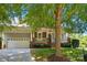 Charming home featuring a two-car garage, well-manicured lawn, and inviting front porch at 8008 Battersea Ct, Waxhaw, NC 28173