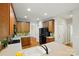 Spacious kitchen featuring wooden cabinets, stainless steel appliances, and a large island with sink at 8008 Battersea Ct, Waxhaw, NC 28173